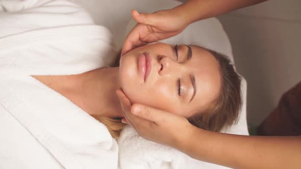 Gorgeous Woman Enjoys Spa Treatment in Clinic