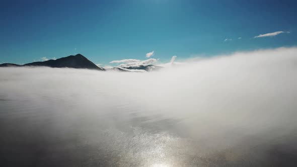 Aerial view of Unalaska Bay with fog on Unalaska island, Alaska, United States.