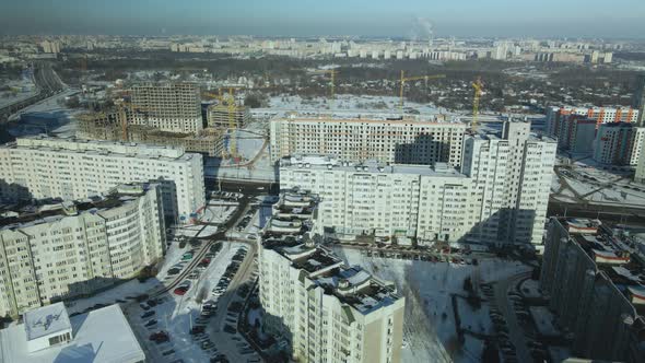 City quarters. Multi-story houses. Winter cityscape.