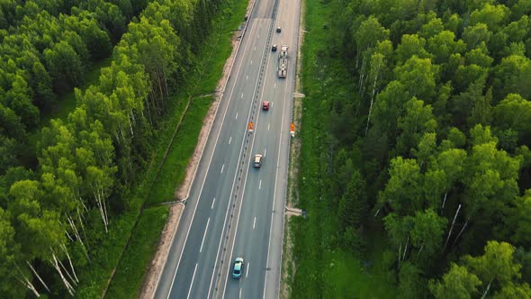 Cars and Trucks Driving on the Highway in Opposite Directions Aerial View