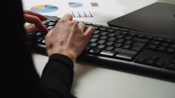 Close up woman hands typing on computer keyboard.