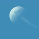 Plane flying passing over moon in clear blue sky cinemagraph loop - VideoHive Item for Sale