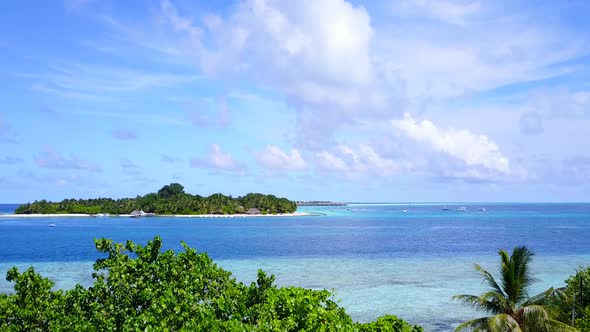 Aerial landscape of exotic seashore beach by blue water with sand background