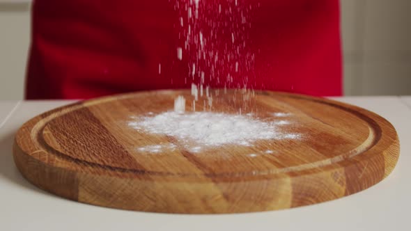 Slow Motion Flour Falls on the Board