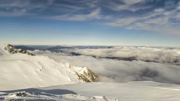 Peaks of Mountains above the Clouds