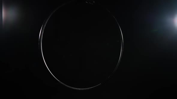 Air Hoop Hanging at Black Background with Backlit Light