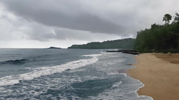 Beautiful view from a drone on a tropical paradise beach on a cloudy day in Kauai, Hawaii, USA