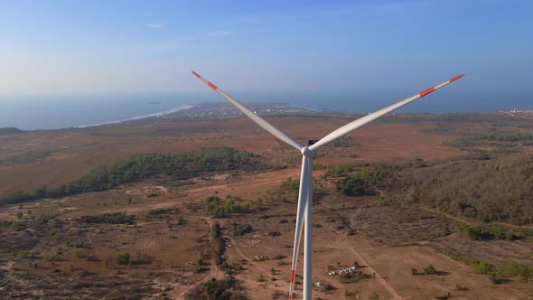 Aerial Shot of a Group of Wind Turbines in a Semidesert Environment