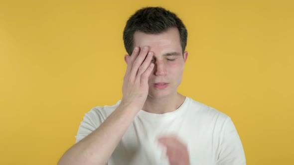 Man with Headache, Yellow Background