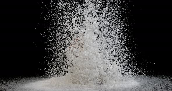 Coconut, cocos nucifera, Powder Exploding against Black Background, slow motion 4K