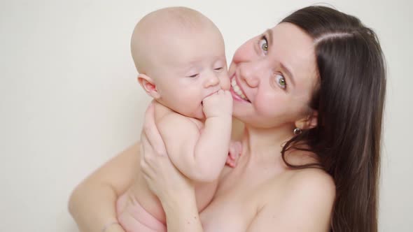Beautiful and Gentle Naked Mom and Baby