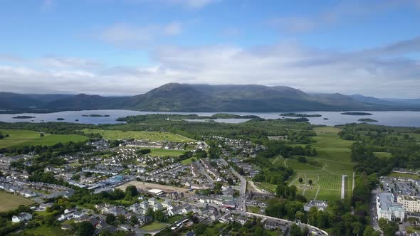 Left to right panning view of tourist town of Killarney, the lakes and renowned macgillycuddy reeks