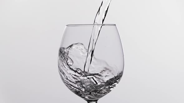 Water Pouring Into a Glass