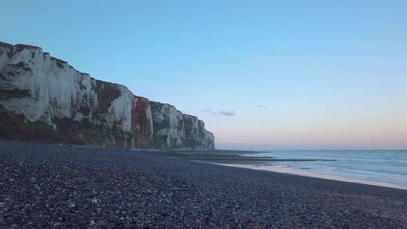 Flying Over Cliffside with La Manche Towards the Sun During Sunset