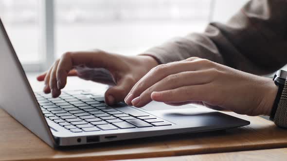 Closeup Female Hands of Caucasian Student Girl Typing on Laptop Keyboard at Table in Home Office