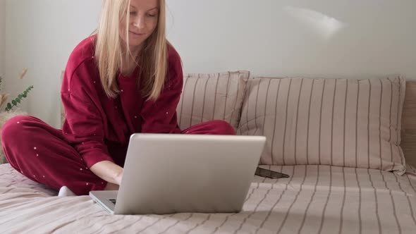 Woman in Bed with Laptop