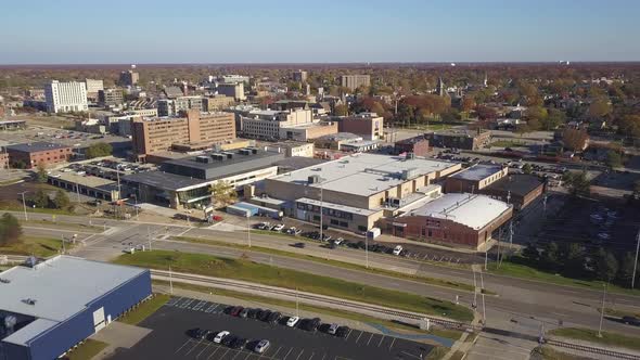 Backward rotating aerial shot of Muskegon, MI, on sunny autumn day