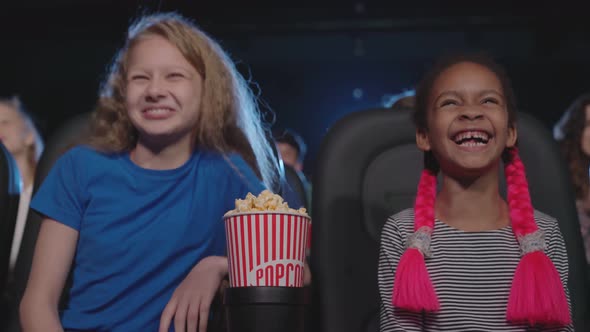 Multiracial Kids Enjoying Funny Cartoon in Cinema Hall.