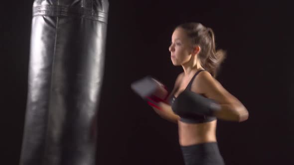 Athletic Woman Boxing Punching-Bag