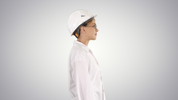 Scientist Physicist Woman Walking in Lab Coat and Hardhat