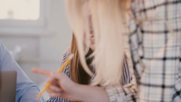 Young Positive Beautiful Female Corporate Company Employee Listening To Female Boss, Smiling at