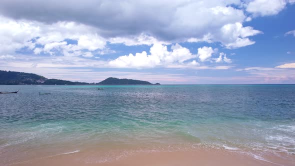 Aerial shot fly over tropical ocean at daytime Beautiful sea in summer season