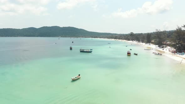  Aerial landscape of tropical bay with boats at sea. Travel destination and paradise beach
