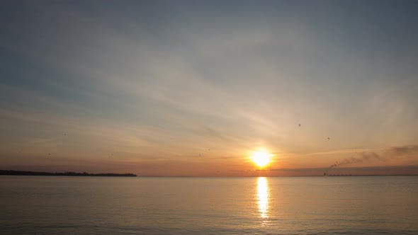 Orange Sunrise By The Bank Of The Big River