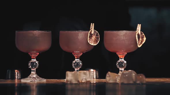 Barman Make a Cocktails on a Bar