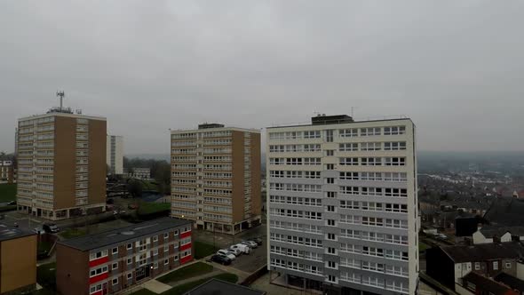 Aerial footage view of high rise tower blocks, flats built in the city of Stoke on Trent to accommod