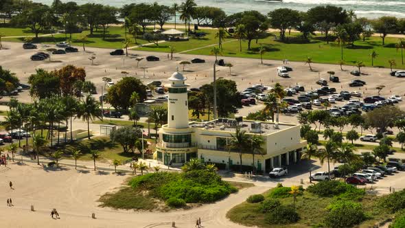 Aerial parallax video Haulover Beach Miami lifeguard headquarters station lighthouse