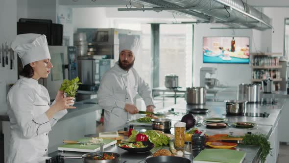 Authentic Chef Using Rosemary Plant Leaves to Cook Tasty Greens Dish