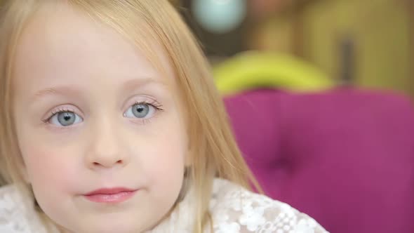 Close up portrait of adorable 3 years old girl, little girl looking at the camera