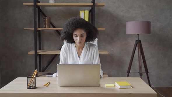 Love My Job. Portrait of Young Pretty Office Worker Working on Her Lap Top