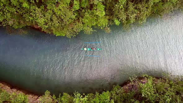 Aerial view of traditional fishing boat in Bojo River, Aloguinsan, Philippines.