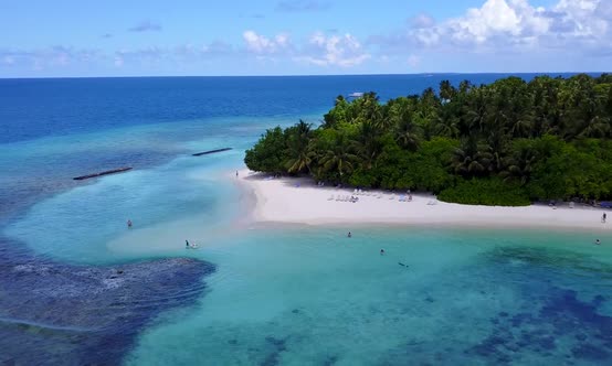 Aerial drone scenery of tourist beach break by ocean with sand background