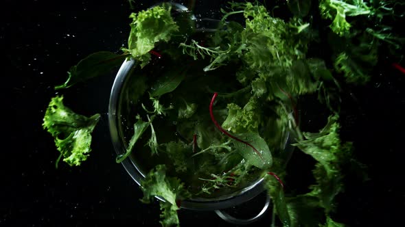 Super Slow Motion Shot of Flying and Rotating Fresh Cuts of Colorful Vegetables at 1000Fps