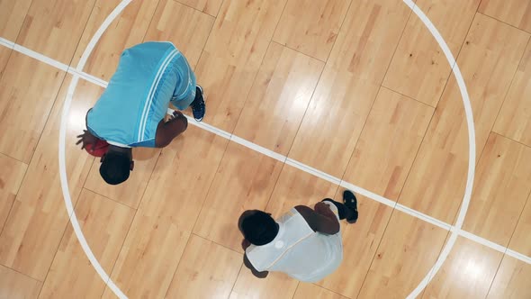 Top View of Africanamerican Rivals Fighting for a Basketball