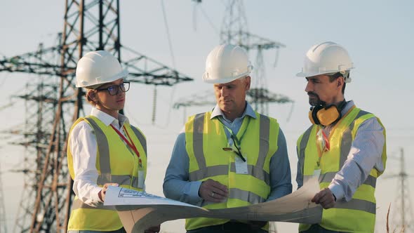 Group of Power Engineers Are Discussing a Project Layout