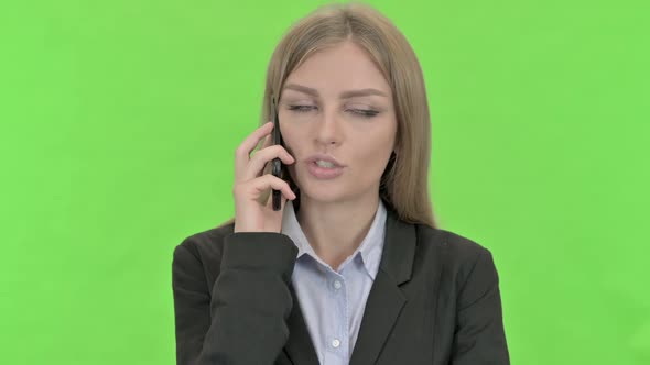 Ambitious Businesswoman Talking on Smartphone Against Chroma Key