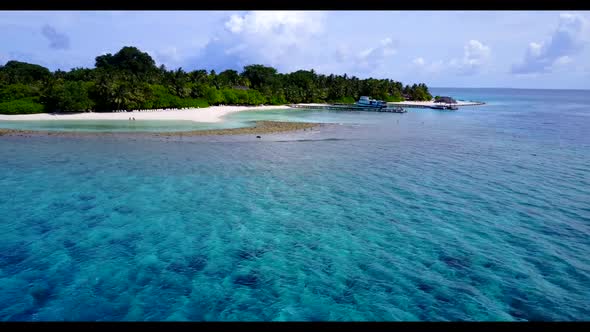 Aerial above panorama of beautiful resort beach wildlife by blue water and white sand background of 