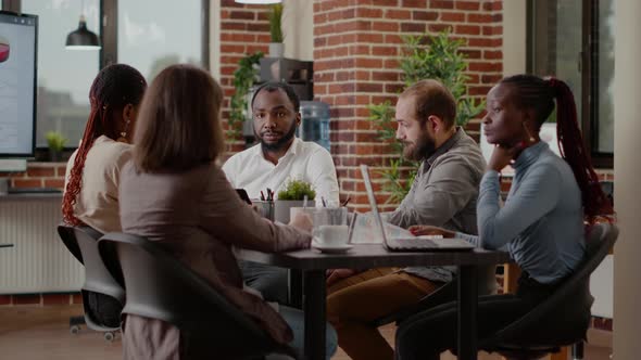 Diverse Group of Workmates Talking About Project Planning