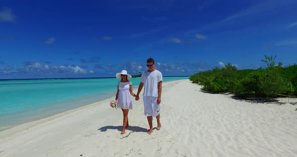 Happy people after marriage in love enjoy luxury on beach on clean white sand 4K background