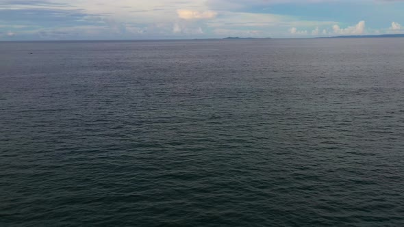 Seascape in the Early Morning. The Sea and the Island in the Distance.