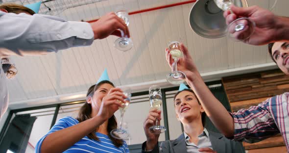 Business executives toasting glasses of champagne