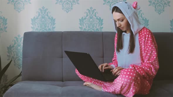 Young Woman in Funny Pajama Working From Home