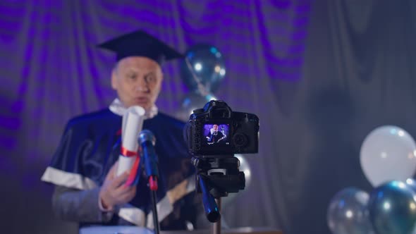 Male University Lecturer Presents Diplomas to Graduates Via Video Link Due to Quarantine and
