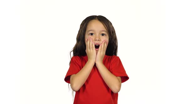 Kid Posing Surprisingly on White Background. 