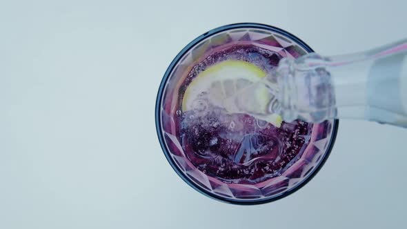 Close Up of Pouring Water with Gas From a Bottle