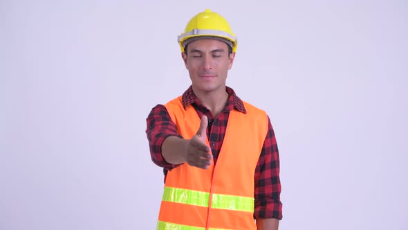 Young Happy Hispanic Man Construction Worker Giving Handshake